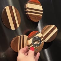 Round multi-wood coasters with magnetic bottle opener — handcrafted kitchen accessories by Two Mittens
