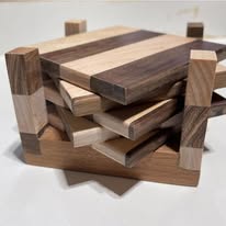 Walnut and maple striped coaster set — handcrafted wooden kitchen accessories